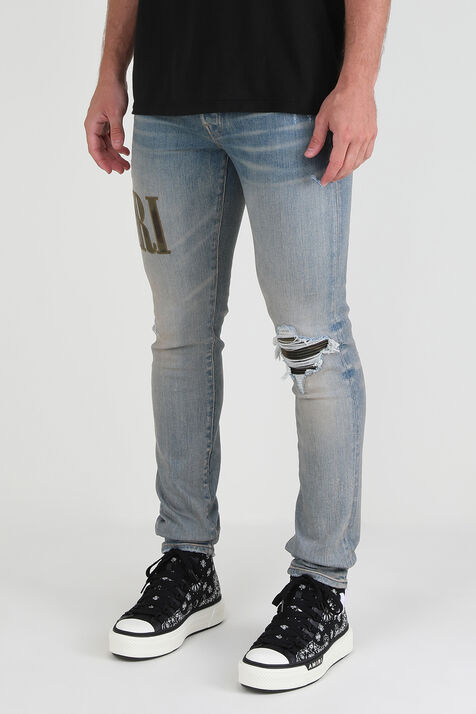 מכנסי ג'ינס סקיני עם לוגו צבאי AMIRI