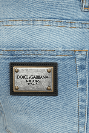 מכנסי ג'ינס סקיני עם לוגו אחורי וקרעים בשטיפה בהירה DOLCE & GABBANA
