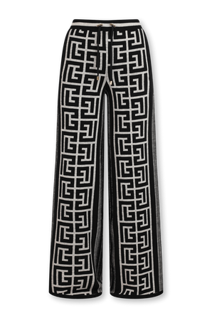 מכנסיים ארוכים מתרחבים עם דוגמה מונוגרמית בגווני שחור ולבן BALMAIN