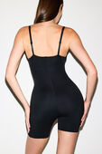 תמונת דוגמן אחורית של SKIMS ULTIMATE BODY MID THIGH BODYSUIT