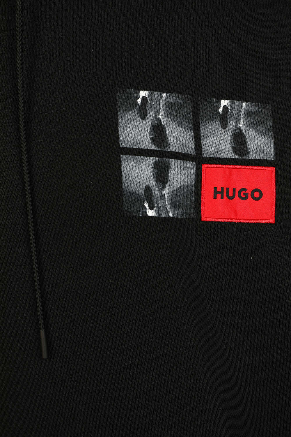 תמונת תקריב של סווטשירט קפו'צון עם הדפס גראפי