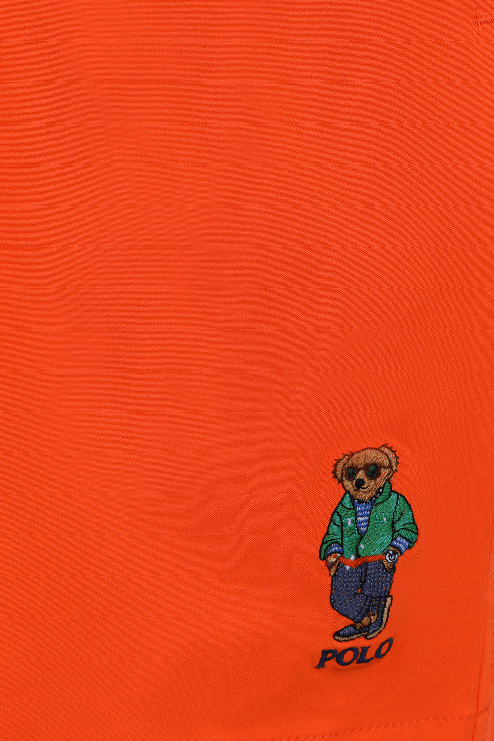 תמונה אחורית של בגד ים קצר כתום עם לוגו דובי