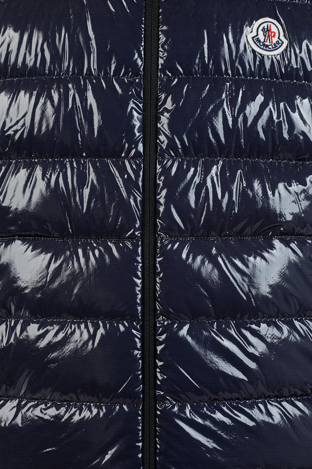 תמונה אחורית של וסט פאפר כחול עם לוגו פאץ'