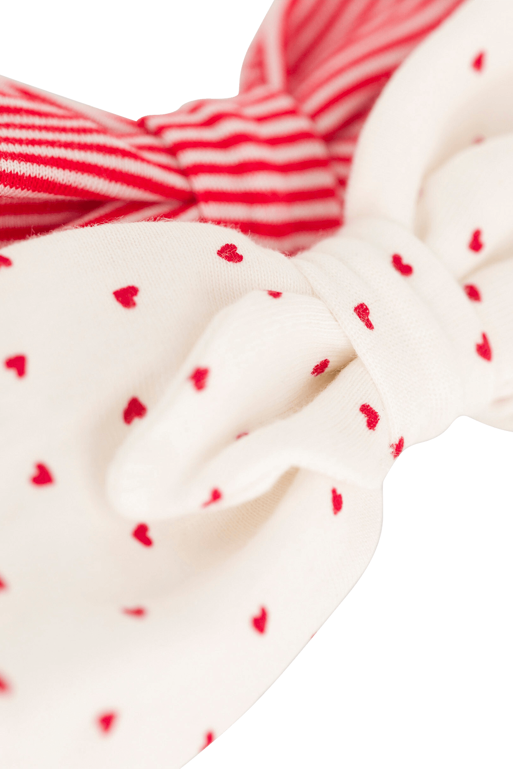 תמונת תקריב של מארז שני פפיונים לשיער בגווני אדום ולבן