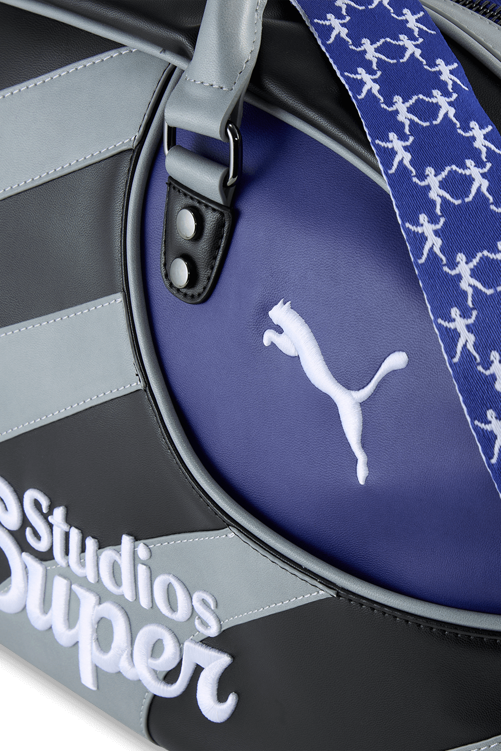 תמונת תקריב של קידסופר X פומה תיק נשיאה