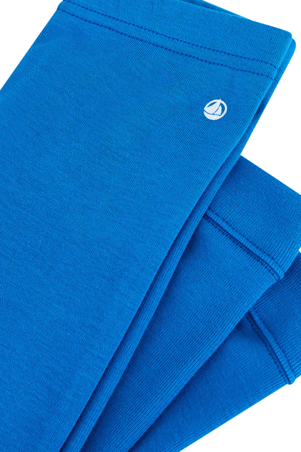 תמונת תקריב של גילאי 0-12 חודשים מכנסי טייץ בכחול