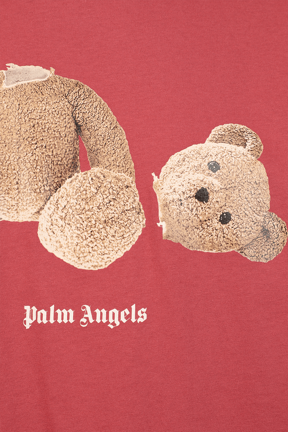 תמונת תקריב של חולצת דובי בצבע ורוד עתיק