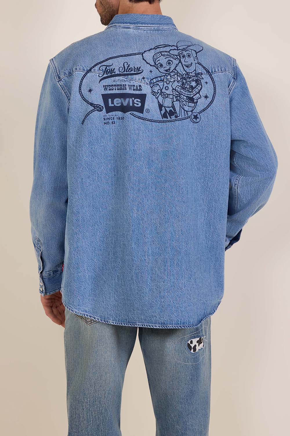 תמונת דוגמן אחורית של ליוויס X צעצוע של סיפור ז'קט ג'ינס