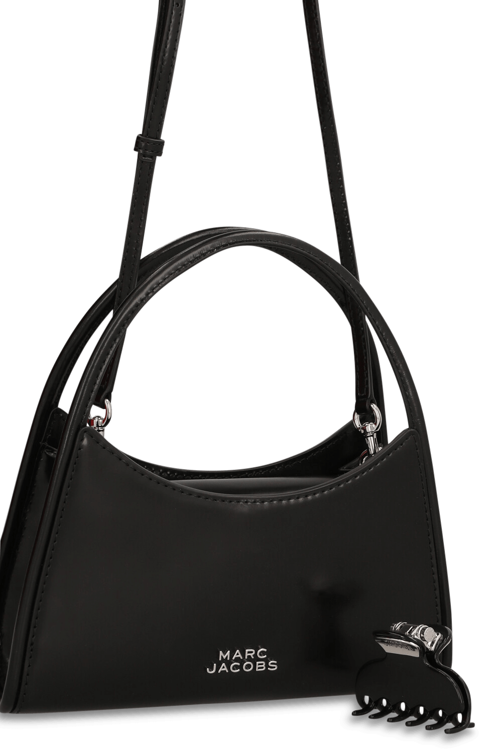 תמונת תקריב של תיק כתף עם קליפס לשיער מיני