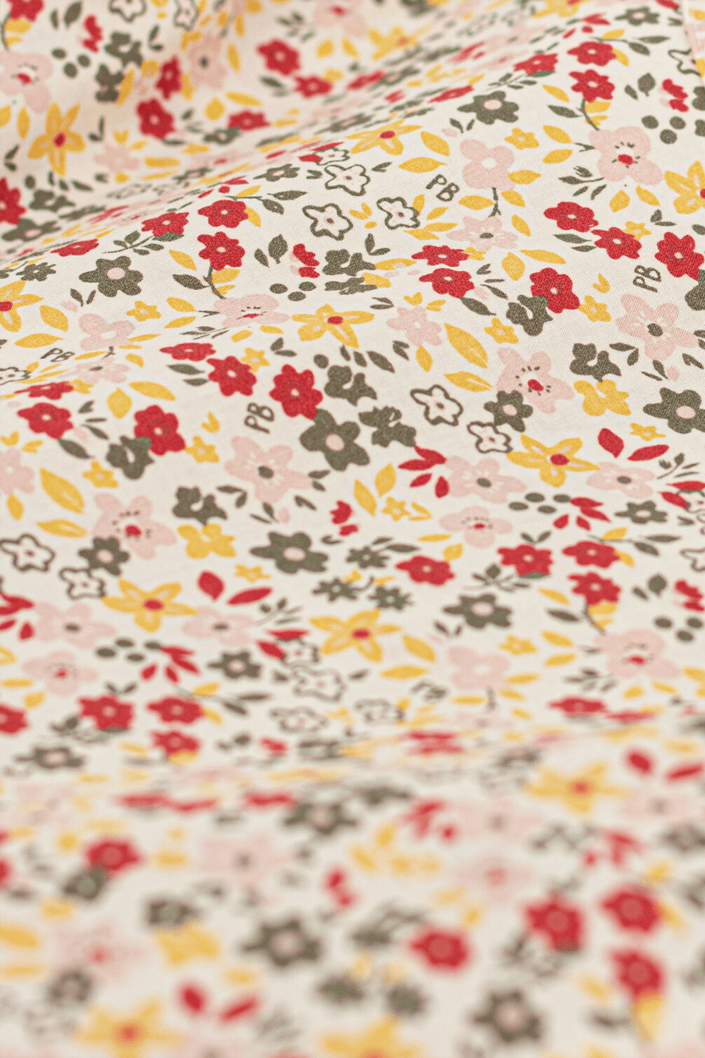 תמונת תקריב של שמלה פרחונית צבעונית קצרה - גילאי 6-12